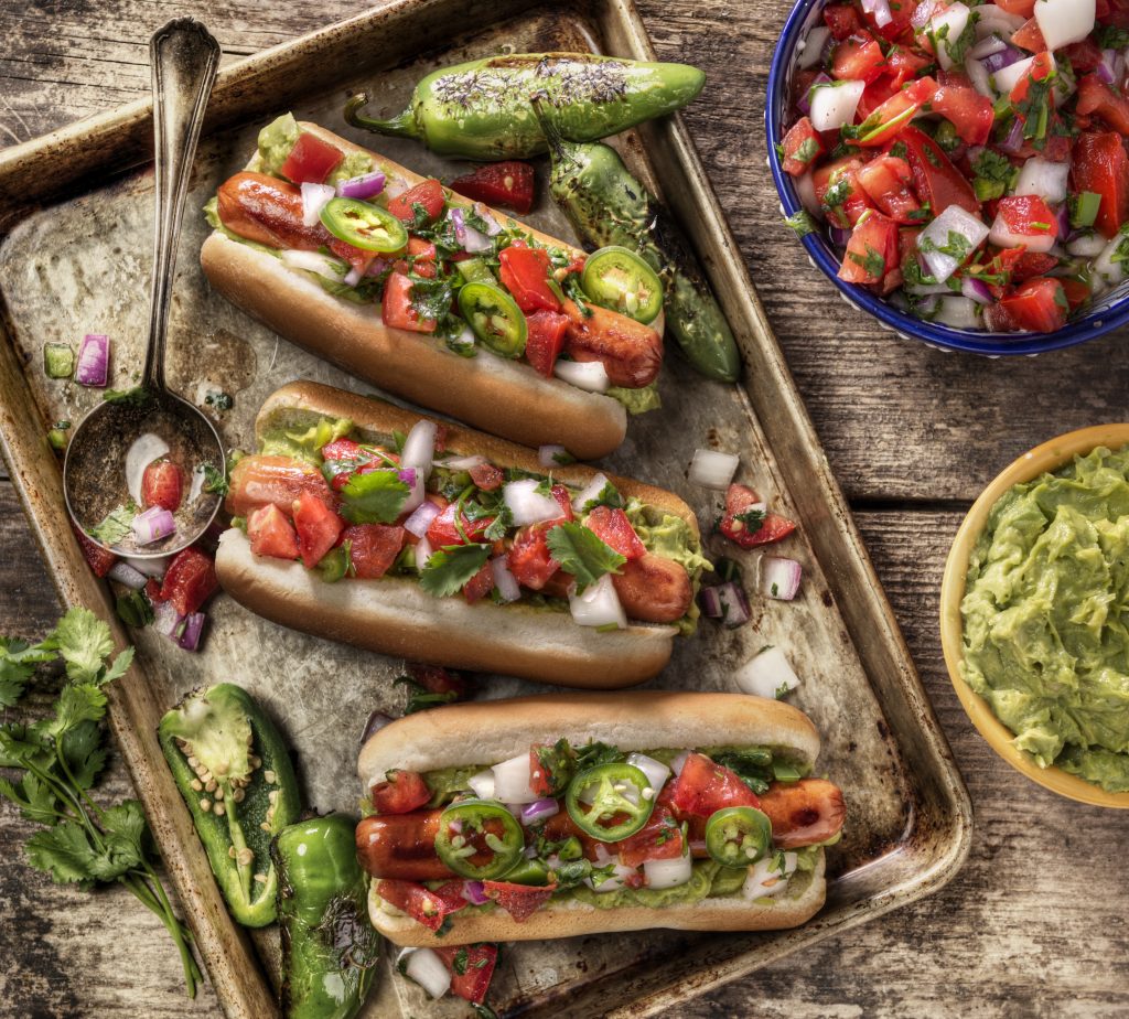 Avocado Hot Dogs on Tray with Avocado and Pico